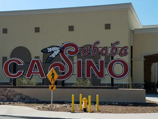 Exterior view of Soboba Casino Resort building featuring large-format LED marquee signs and entrance displays powered by SpinetiX media players