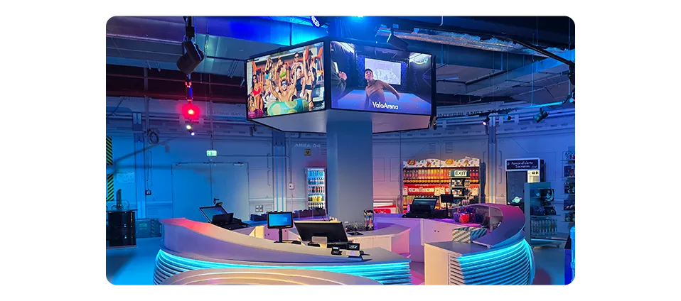 Space Magic entertainment center welcome area with large digital welcome displays showing attraction schedules, safety information, and ticket options