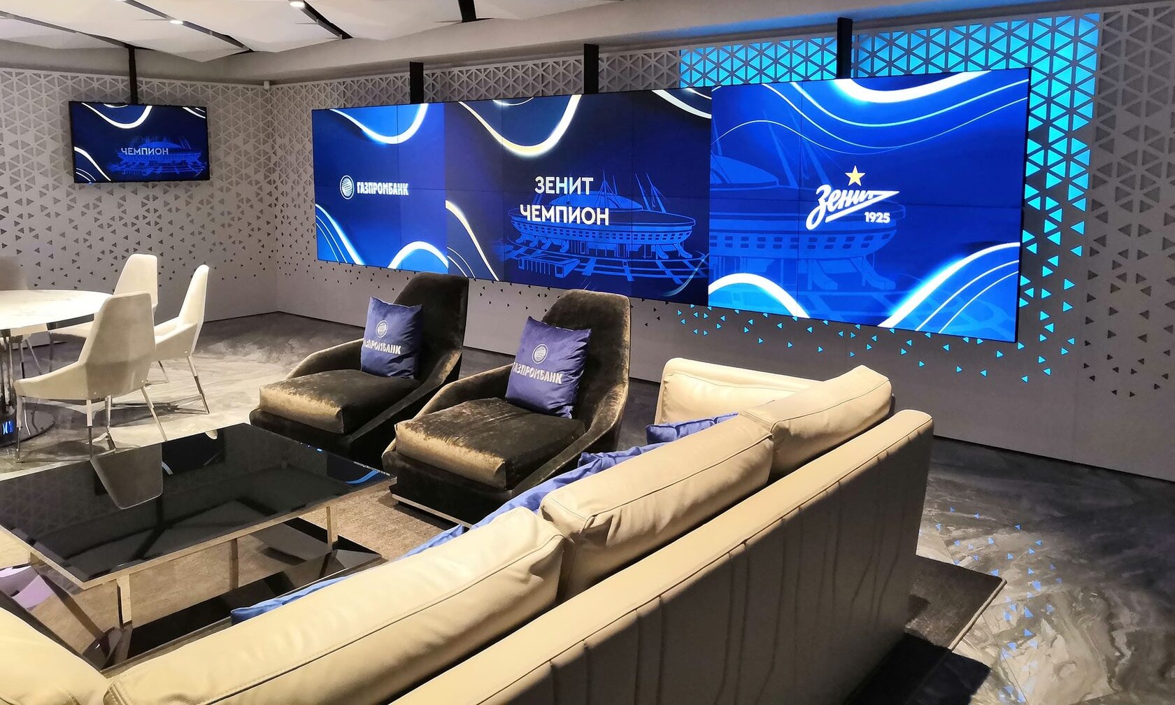 Interactive digital display in a stadium VIP hospitality zone showing personalized match statistics, food ordering menu, and exclusive sponsor content